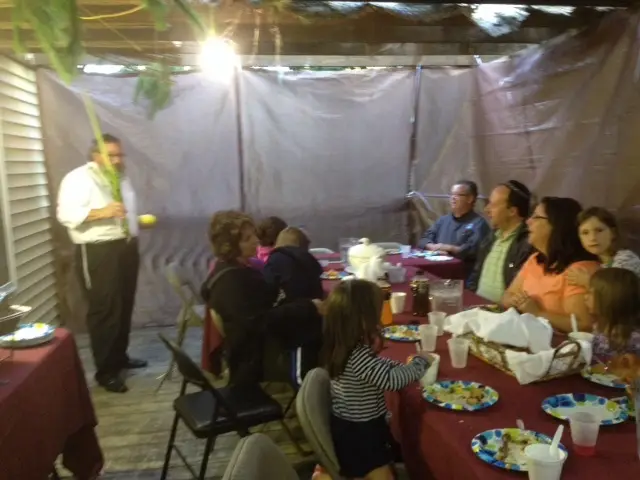 Families enjoy a Super Supper in the Sukkah Saying a special brocha with Rabbi Mendel Fogelman Arts and Crafts in the Sukkah!