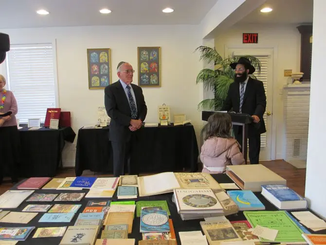 March 21 reception recognized donation of 100-plus Haggadot from Mike Berger of Vienna.