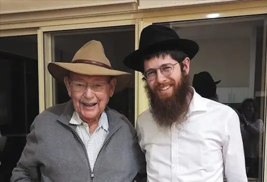 Lennox Head resident Henri Bader (left), 93, with Rabbi Menachem Aron on May 28.
