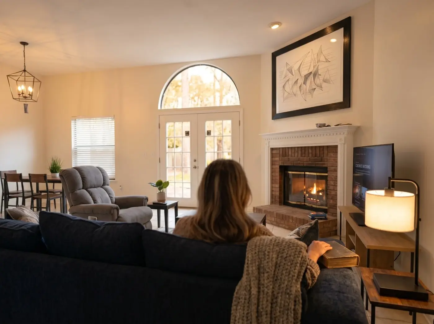 Guest relaxing by the fireplace