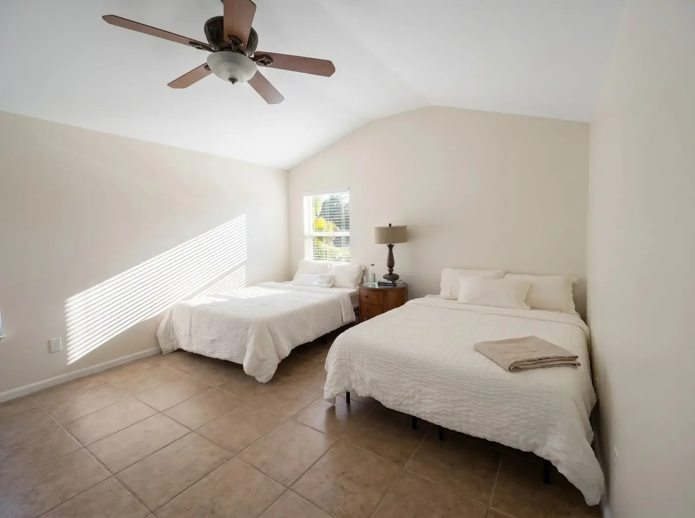 Bright bedroom with two beds
