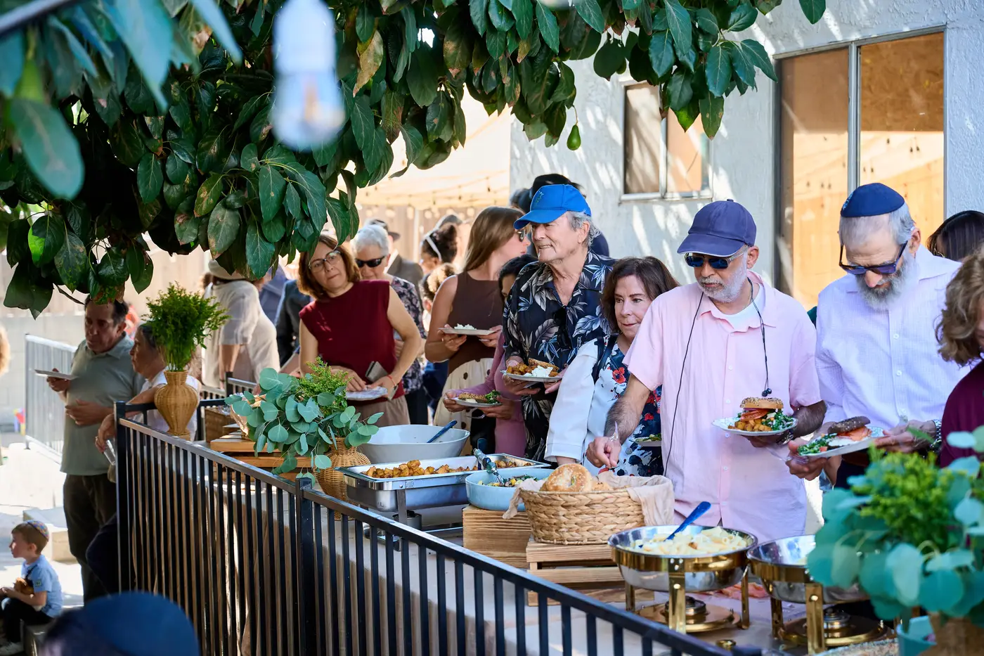 Community gathering in the sukkah