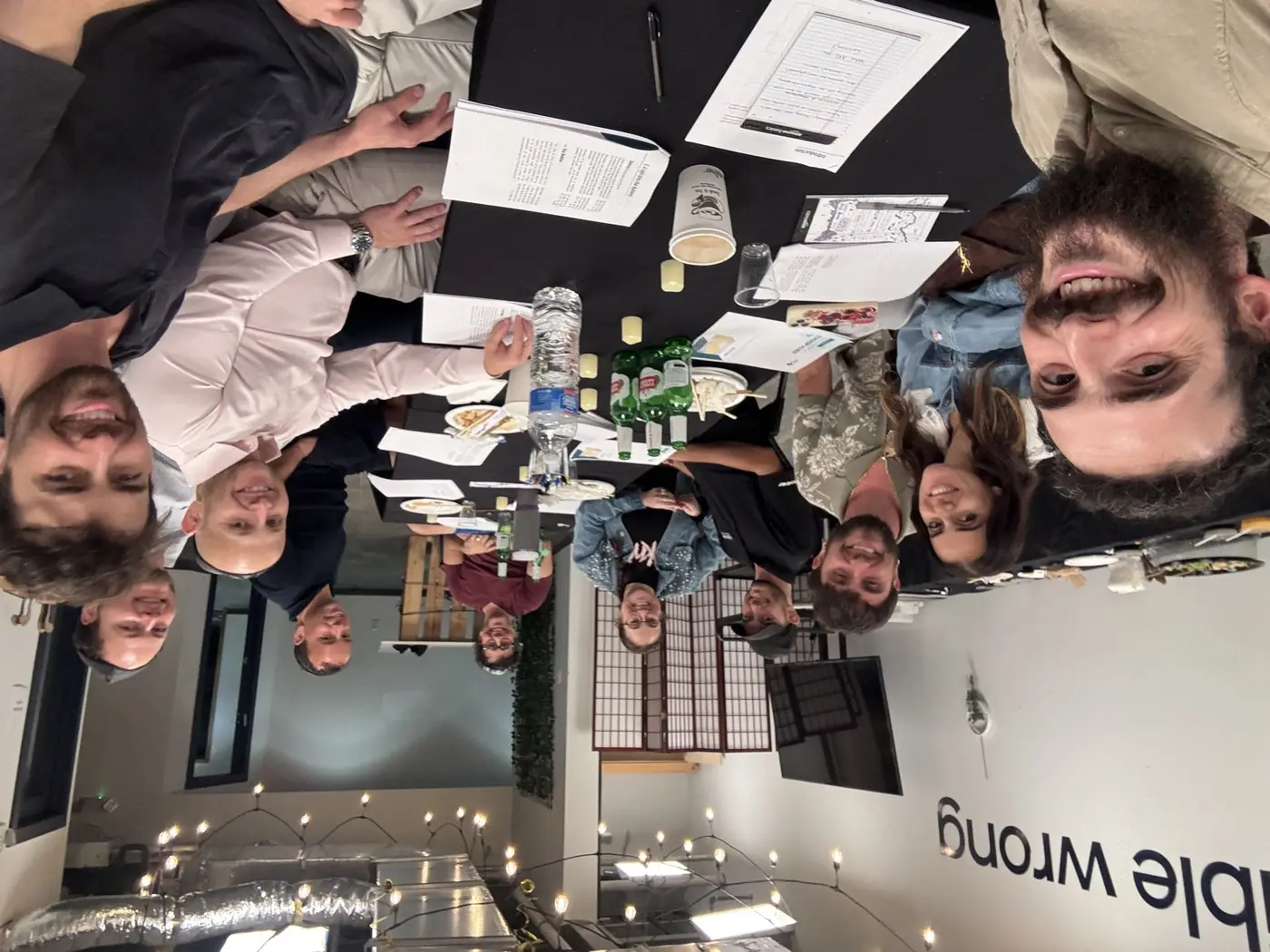 Group learning together around a table over sushi