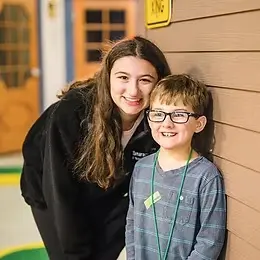 Friendship Circle Kansas City Volunteer with child participant .