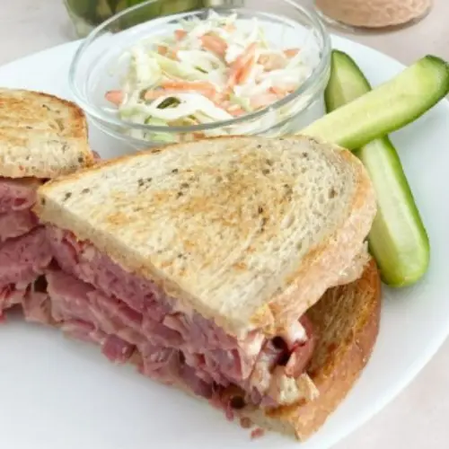 Corned Beef Sandwich – $18 Served with: • Sour Pickle • Coleslaw